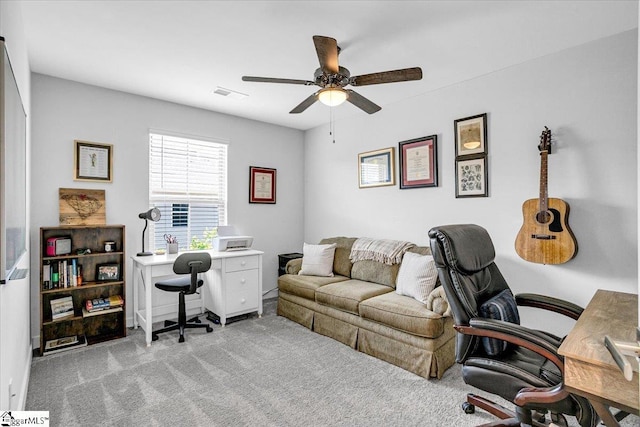 carpeted office with ceiling fan and visible vents