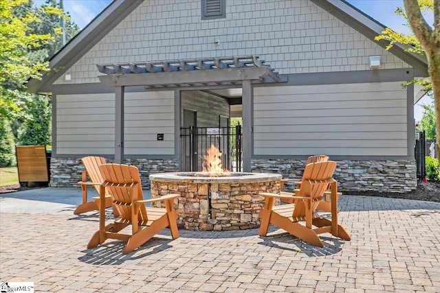 view of patio / terrace featuring a pergola and an outdoor fire pit