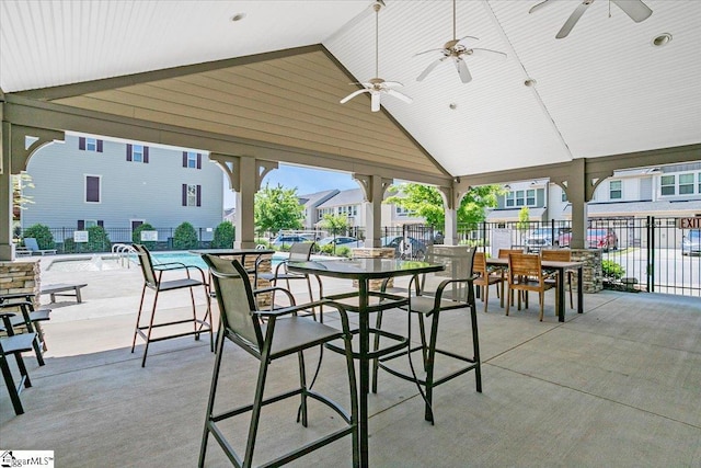 view of patio with fence and ceiling fan