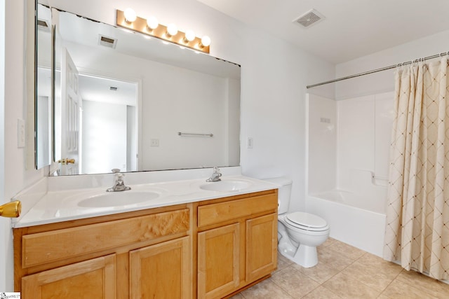 bathroom with visible vents, toilet, and a sink