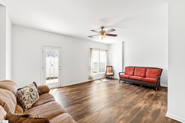 living room with baseboards, a ceiling fan, dark wood-type flooring, and visible vents