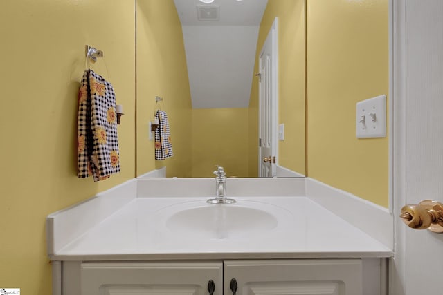bathroom with vanity and visible vents