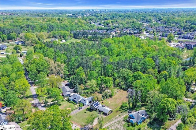 aerial view featuring a view of trees