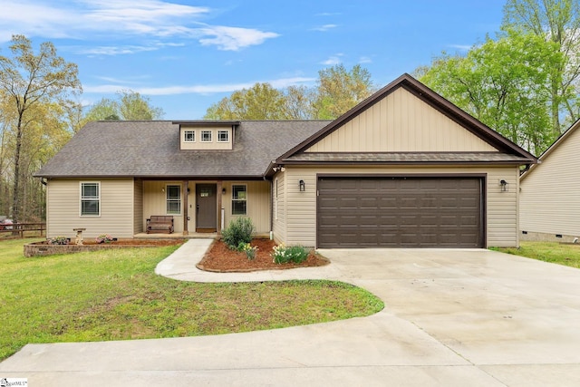 view of front of house with roof with shingles, concrete driveway, covered porch, an attached garage, and a front yard