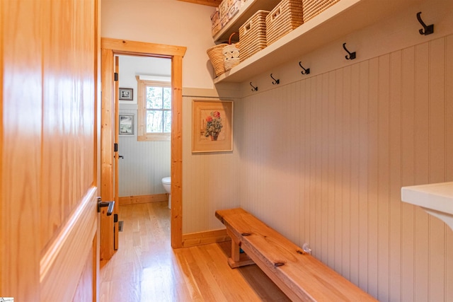 mudroom featuring light wood-style floors and baseboards