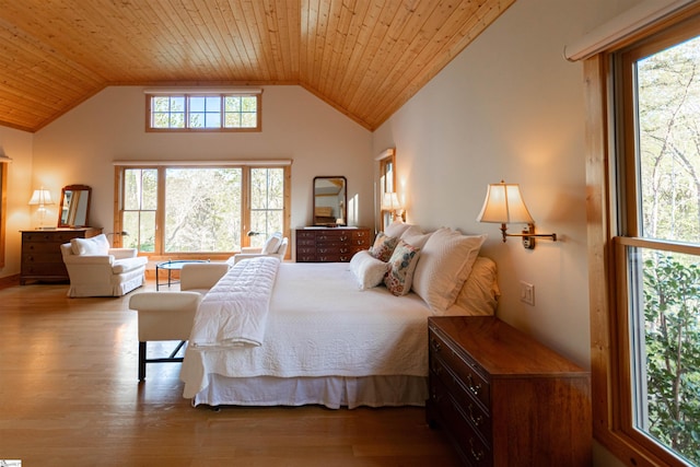 bedroom with wood ceiling, vaulted ceiling, and wood finished floors