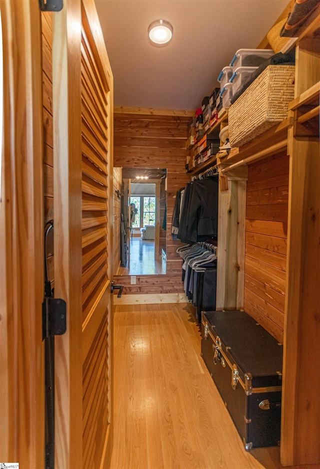 spacious closet with wood finished floors