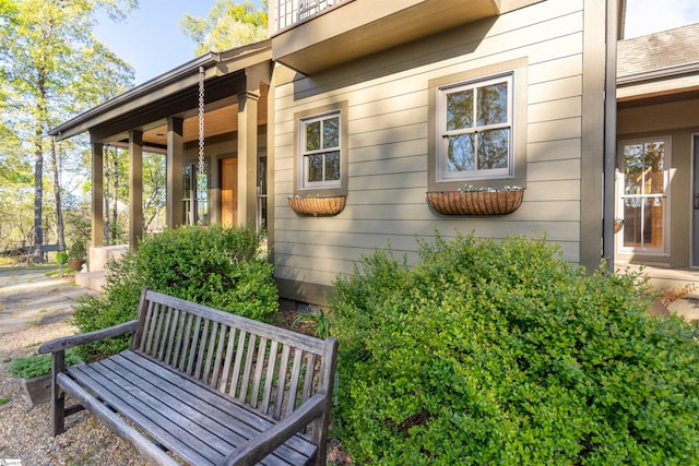 view of side of property with covered porch