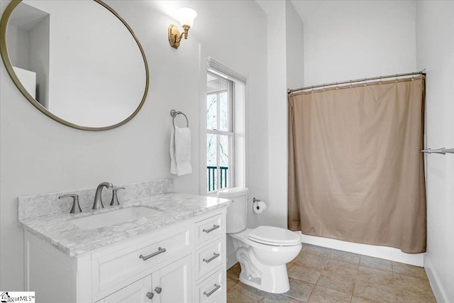 full bath featuring toilet, vanity, and curtained shower