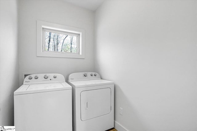 clothes washing area with washer and dryer and laundry area