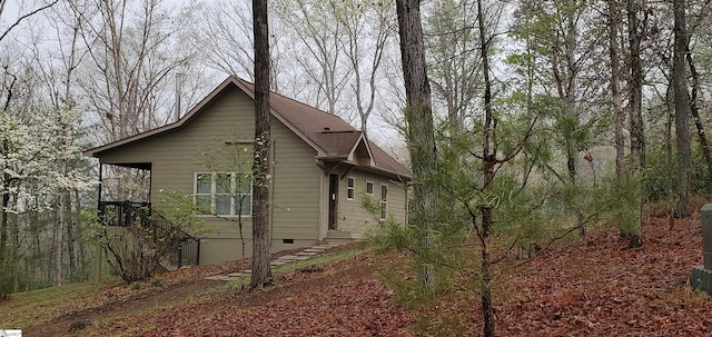 view of side of home with crawl space