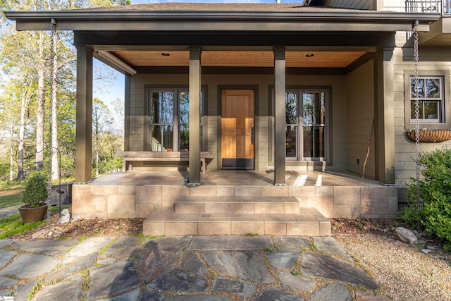 doorway to property with a porch