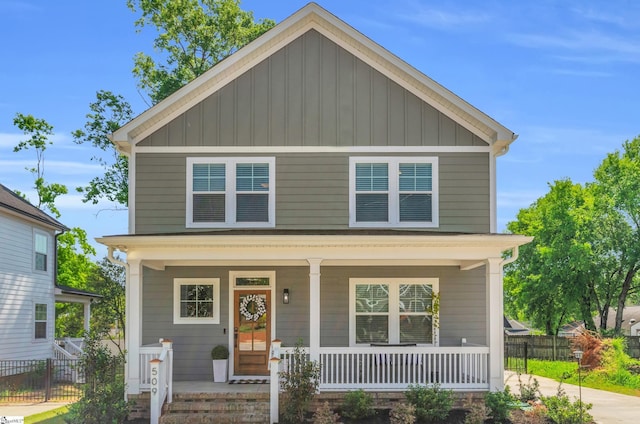 509 Dunbar St, Greenville, SC 29601 - american foursquare style home featuring a porch, fence, and board and batten siding