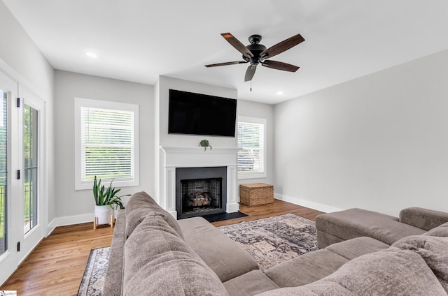 509 Dunbar St, Greenville, SC 29601 - living room with a fireplace with flush hearth, a ceiling fan, baseboards, and wood finished floors
