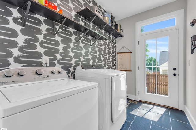 509 Dunbar St, Greenville, SC 29601 - clothes washing area featuring separate washer and dryer, baseboards, dark tile patterned floors, and laundry area
