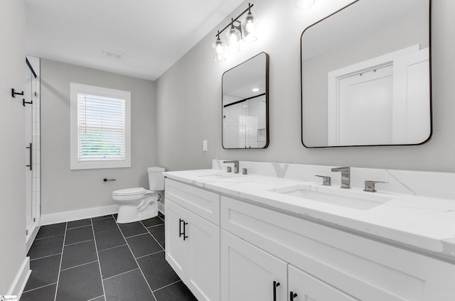 509 Dunbar St, Greenville, SC 29601 - bathroom with baseboards, an enclosed shower, a sink, and toilet