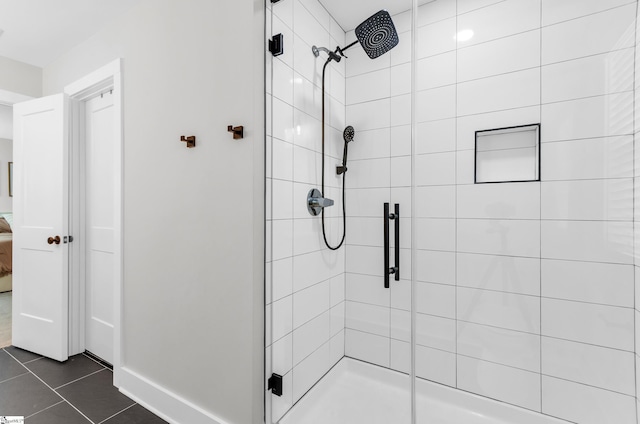 509 Dunbar St, Greenville, SC 29601 - ensuite bathroom with baseboards, tile patterned floors, a stall shower, and connected bathroom