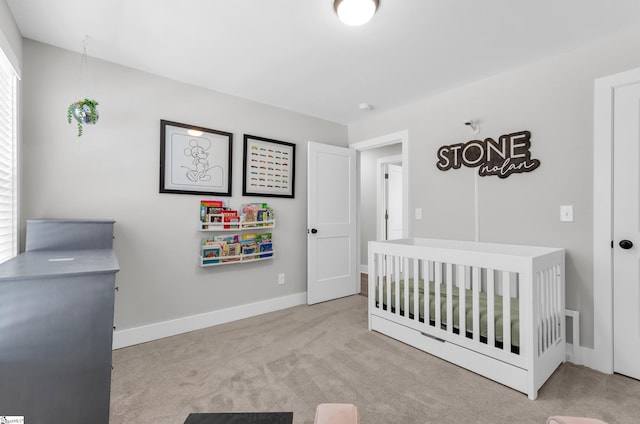509 Dunbar St, Greenville, SC 29601 - bedroom with a crib, baseboards, and carpet flooring