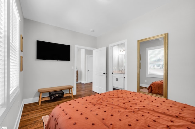 509 Dunbar St, Greenville, SC 29601 - bedroom featuring ensuite bath, baseboards, and wood finished floors