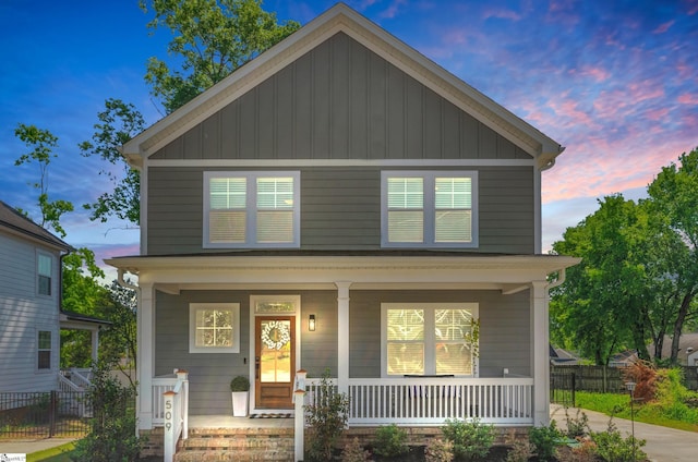 509 Dunbar St, Greenville, SC 29601 - american foursquare style home featuring fence, board and batten siding, and covered porch