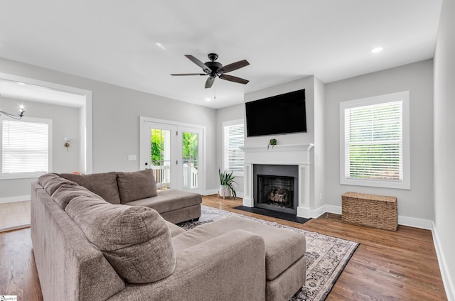 509 Dunbar St, Greenville, SC 29601 - living area featuring wood finished floors, ceiling fan with notable chandelier, a fireplace with flush hearth, baseboards, and recessed lighting