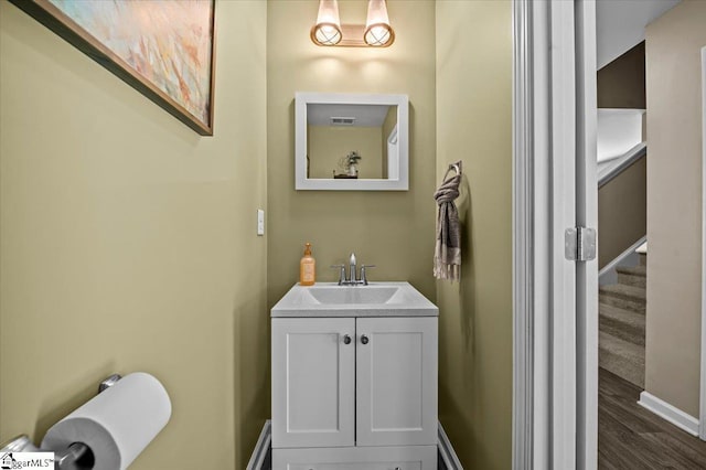 224 Hillendale Way, Pelzer, SC 29669 - half bath featuring baseboards, vanity, wood finished floors, and visible vents