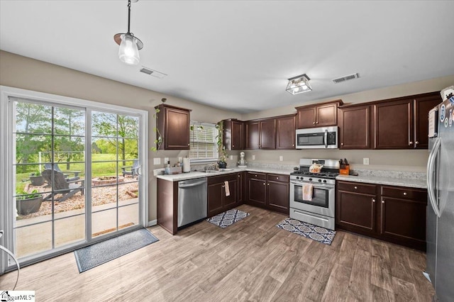 224 Hillendale Way, Pelzer, SC 29669 - kitchen featuring dark brown cabinets, stainless steel appliances, visible vents, and light countertops