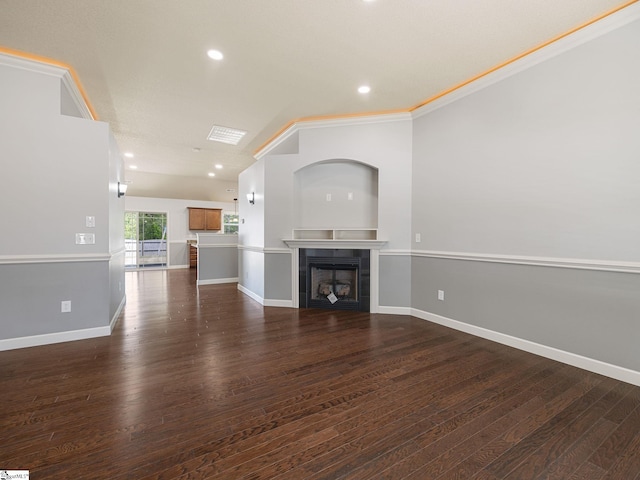 unfurnished living room with recessed lighting, dark wood finished floors, a tiled fireplace, and baseboards