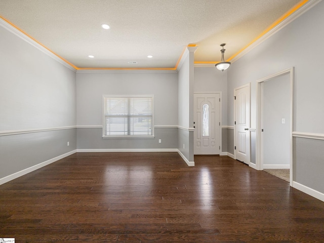 foyer with wood finished floors, baseboards, recessed lighting, and crown molding