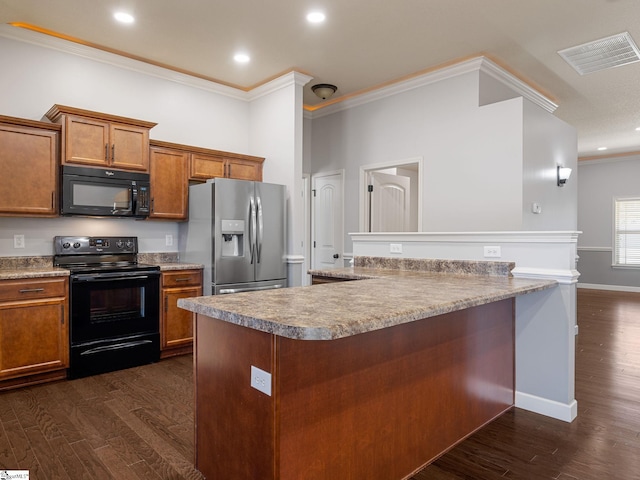 kitchen featuring brown cabinets, visible vents, crown molding, and black appliances