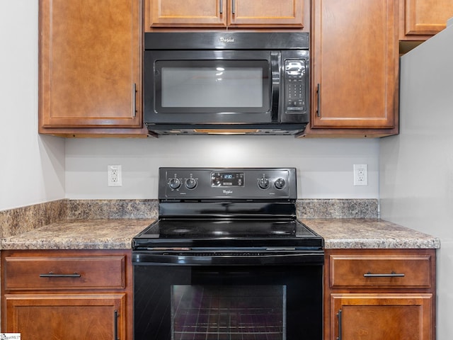 kitchen with black appliances
