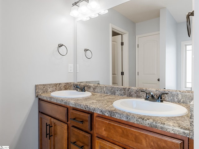 full bath featuring a sink and double vanity