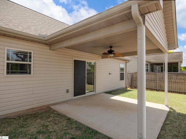 view of patio / terrace with fence and ceiling fan