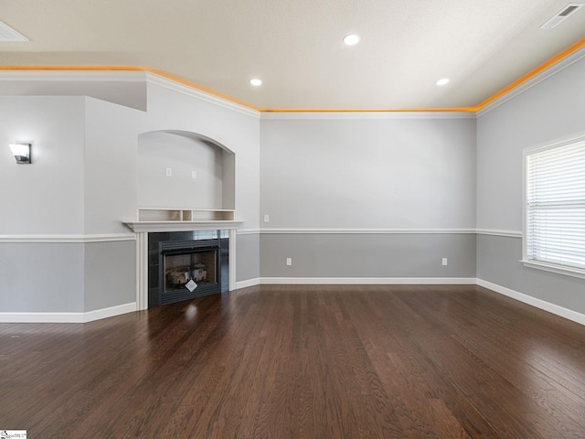 unfurnished living room with recessed lighting, a tiled fireplace, wood finished floors, and visible vents