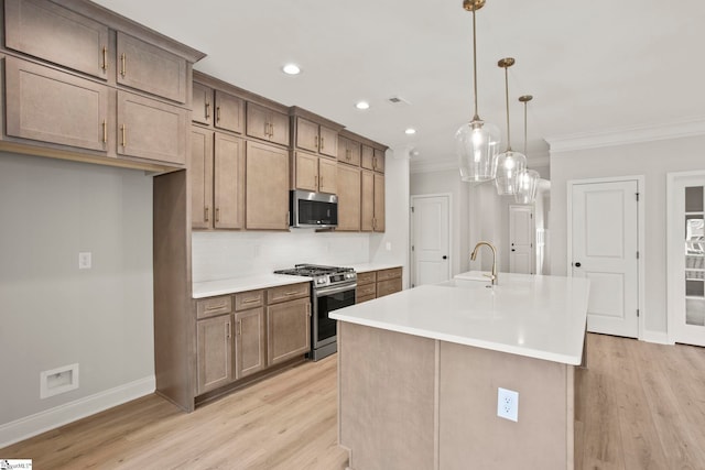 kitchen with a sink, baseboards, backsplash, crown molding, and appliances with stainless steel finishes