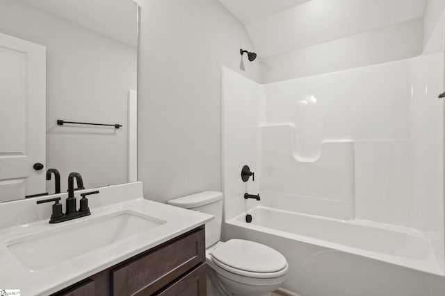 full bath featuring toilet, vanity, and shower / tub combination