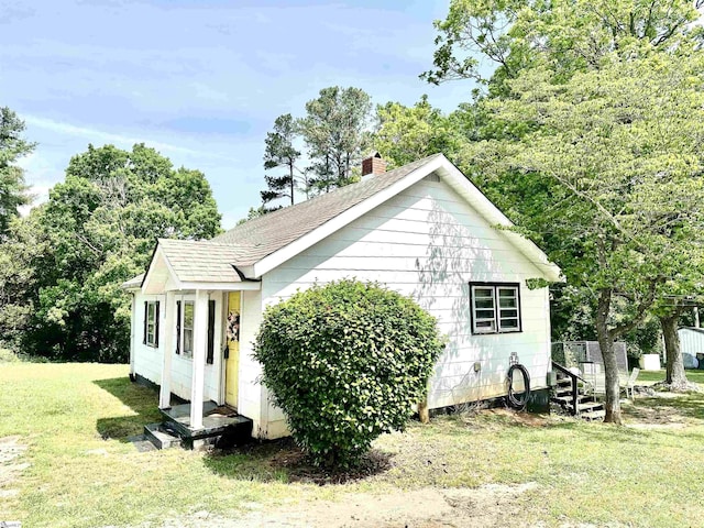 17920 Asheveille Hwy, Campobello, SC 29322 - view of side of home with a yard, a chimney, and a shingled roof
