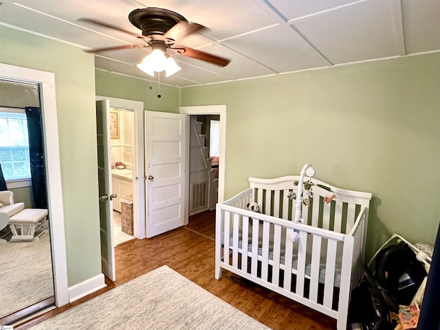 17920 Asheveille Hwy, Campobello, SC 29322 - bedroom with a nursery area, ceiling fan, wood finished floors, and visible vents