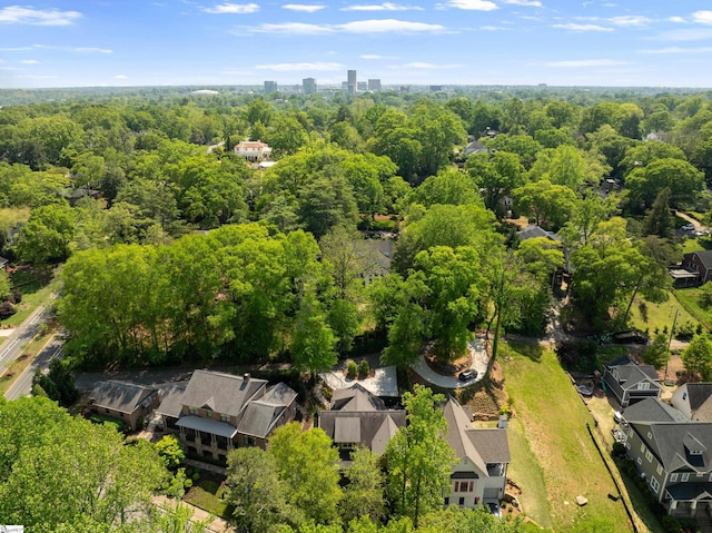 drone / aerial view featuring a forest view