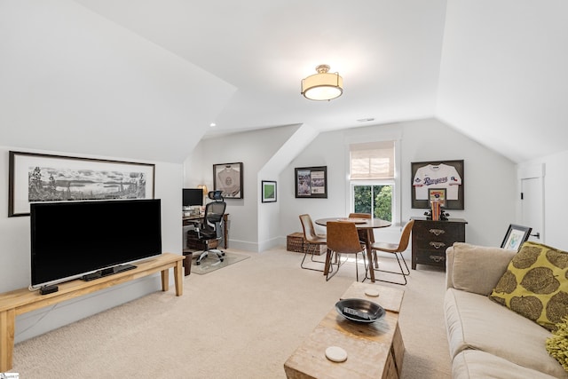 living area with vaulted ceiling and carpet floors