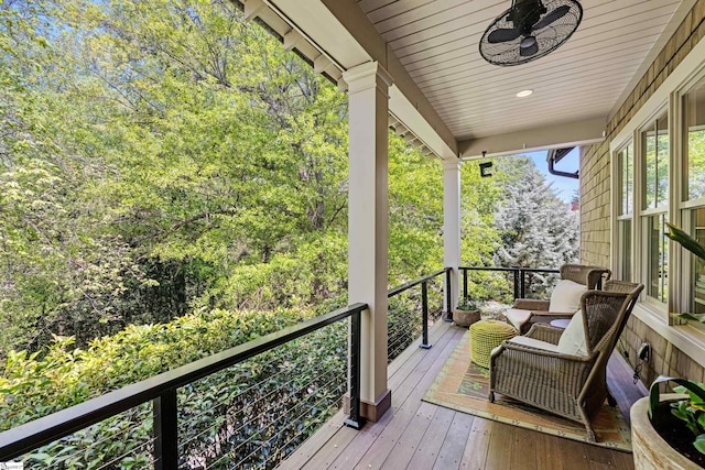 exterior space with a porch and a ceiling fan
