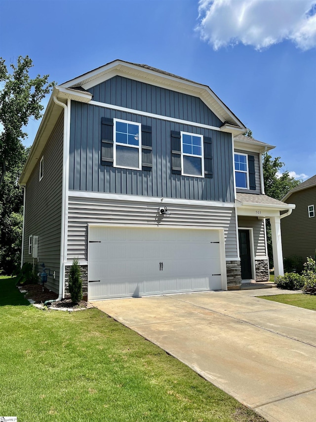 craftsman-style home with driveway, stone siding, board and batten siding, an attached garage, and a front yard
