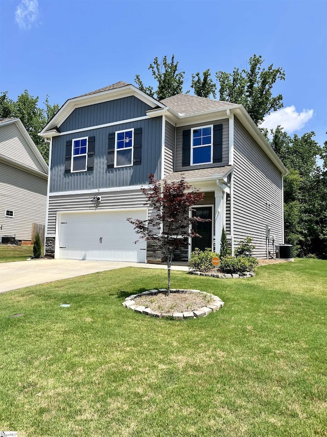 craftsman house featuring a front lawn, driveway, central AC, a garage, and board and batten siding