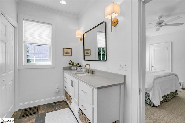 bathroom featuring ensuite bathroom, stone tile floors, baseboards, ornamental molding, and visible vents