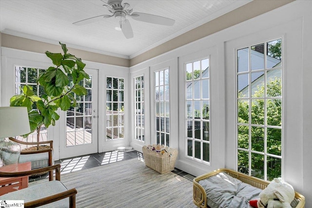 sunroom with french doors, tile patterned flooring, and ornamental molding