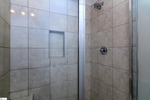 full bath with a shower stall