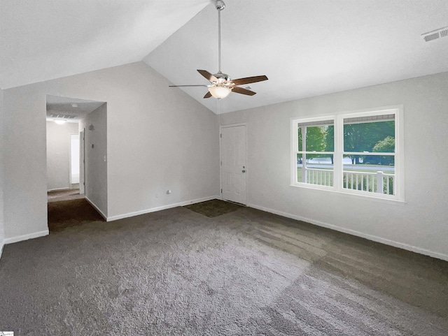 interior space featuring ceiling fan, carpet floors, baseboards, lofted ceiling, and visible vents