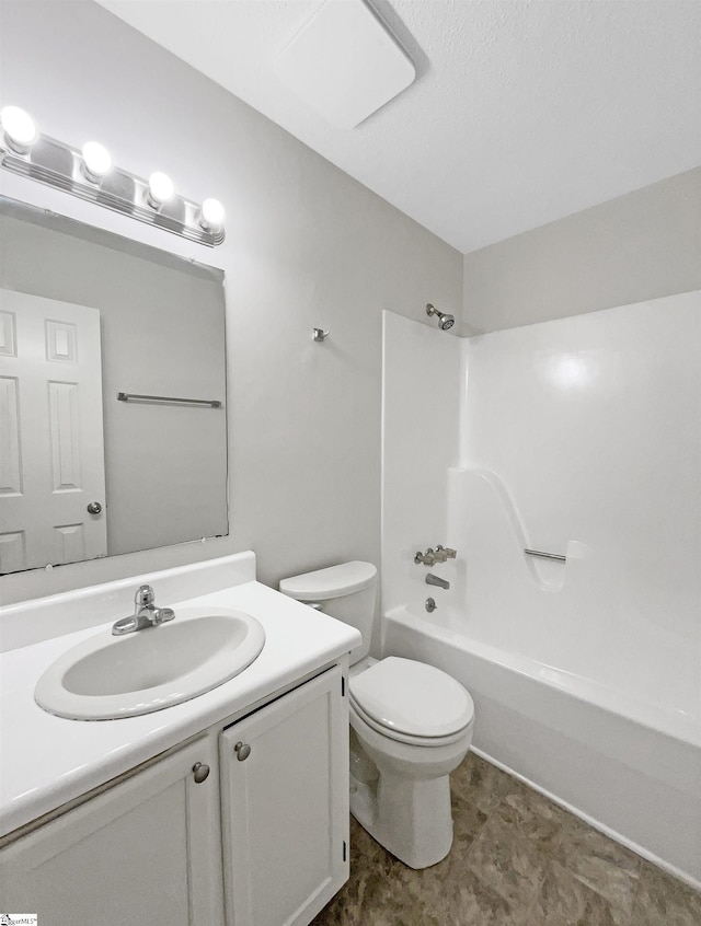 bathroom with toilet, shower / bathtub combination, and vanity