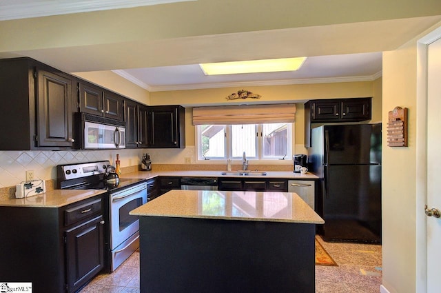 kitchen with light stone countertops, stainless steel appliances, a sink, and ornamental molding