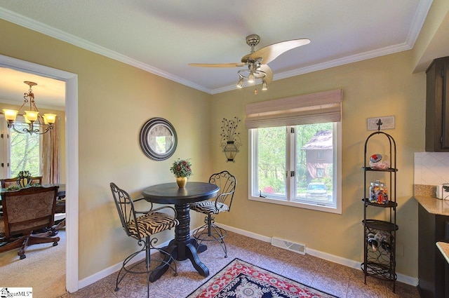 dining area featuring a wealth of natural light, ornamental molding, visible vents, and baseboards